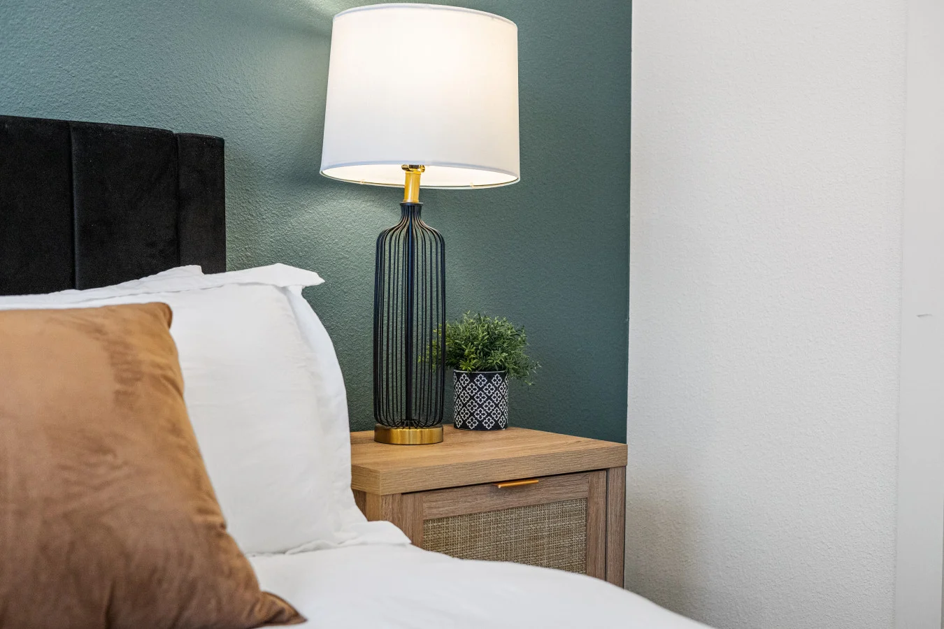 The bedroom’s serene ambiance invites you to relax, with a plush bed that promises a restful night's sleep.
