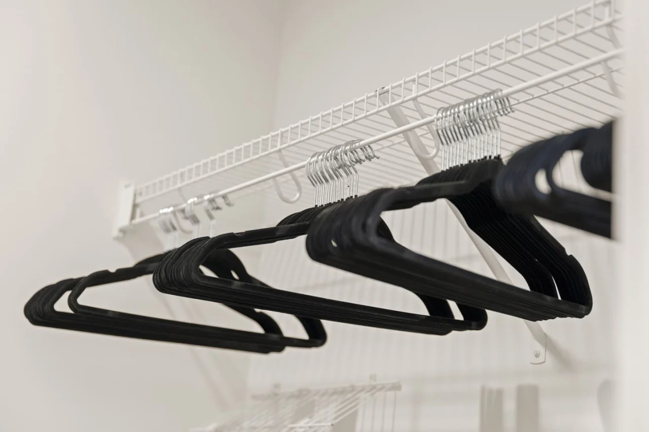 Modern built-in closets with hangers and shelving, perfect for keeping your clothes organized during your stay.