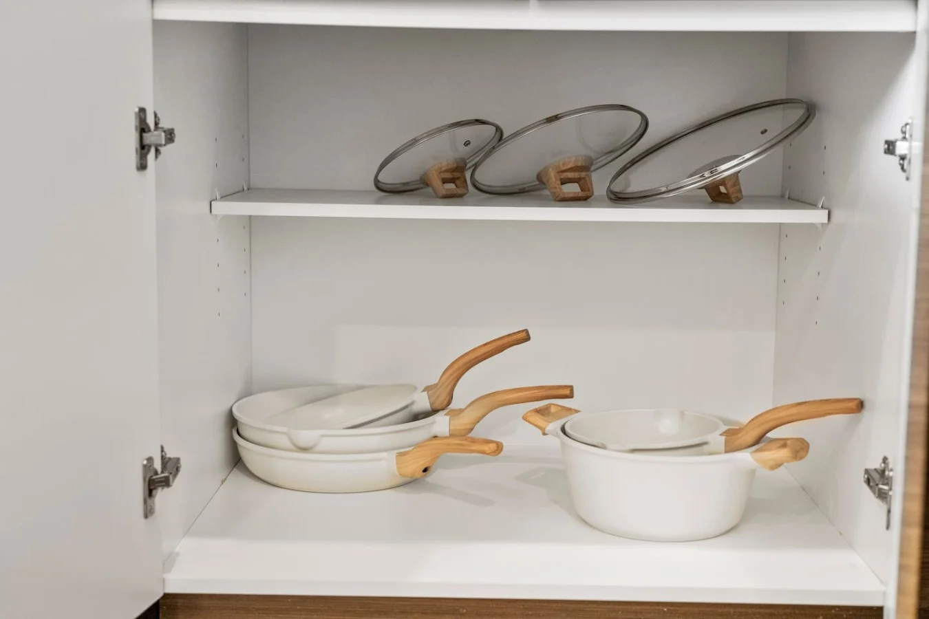 Kitchen cabinets stocked with cooking wares, glassware and silverwares, ideal for mixing up your favorite meals and drinks during your stay.