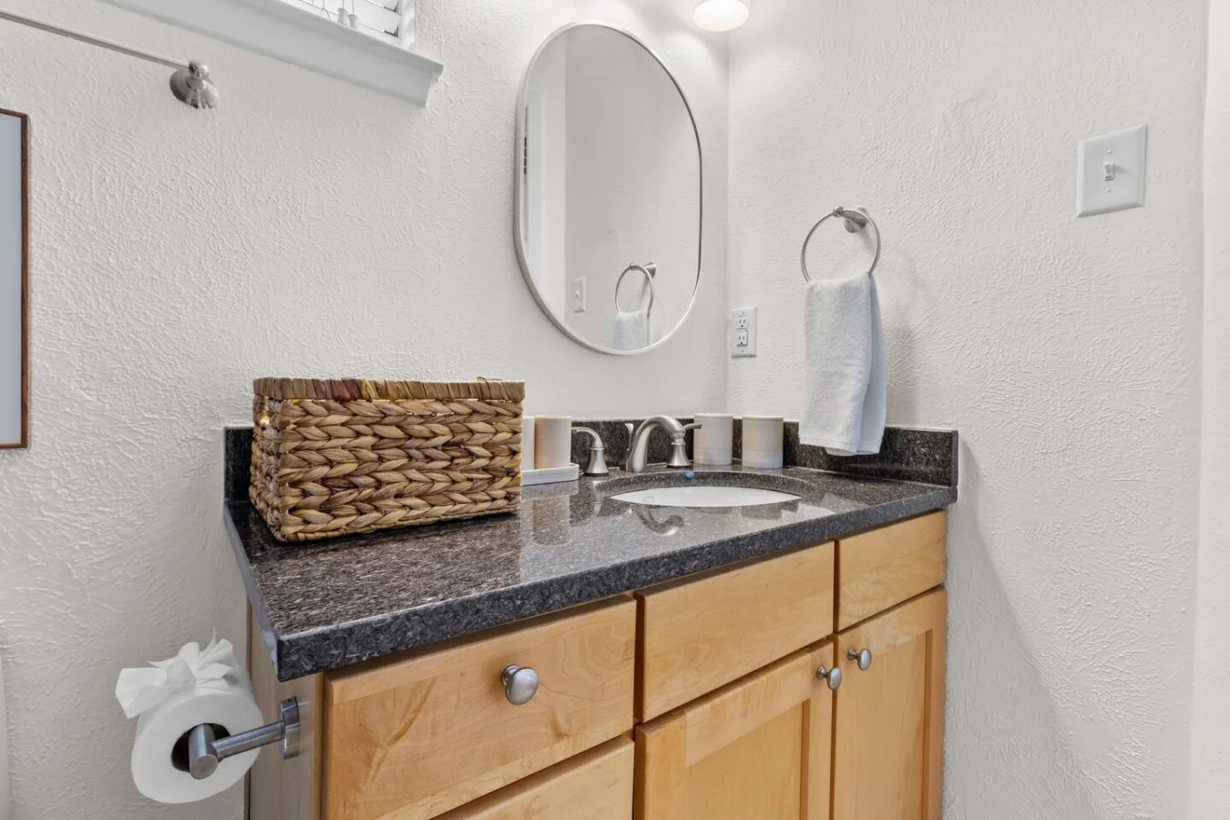 Spacious vanity with granite countertop
