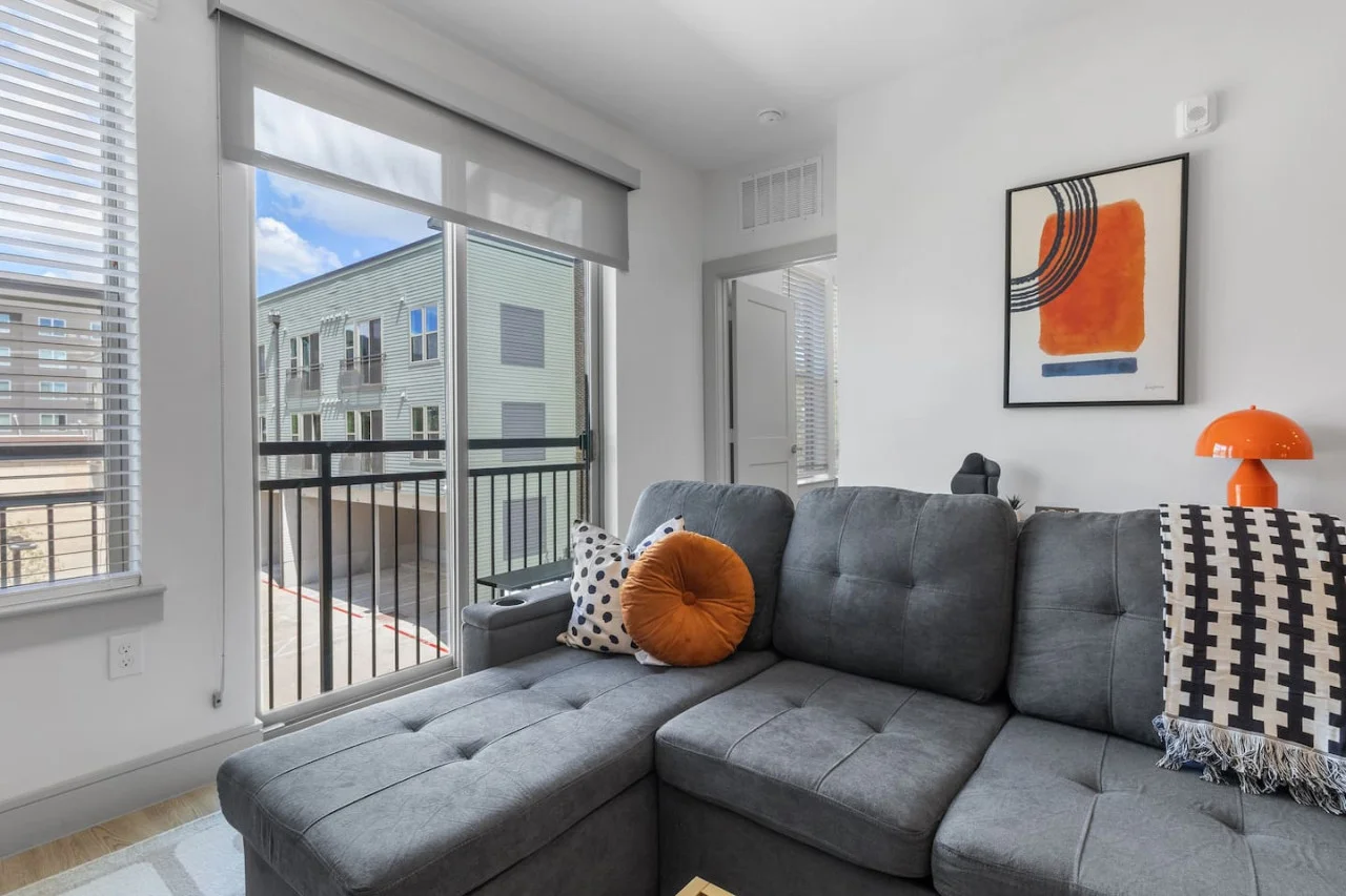 You feel a sense of peace as you step into the living room , with its inviting decor and soothing tones.