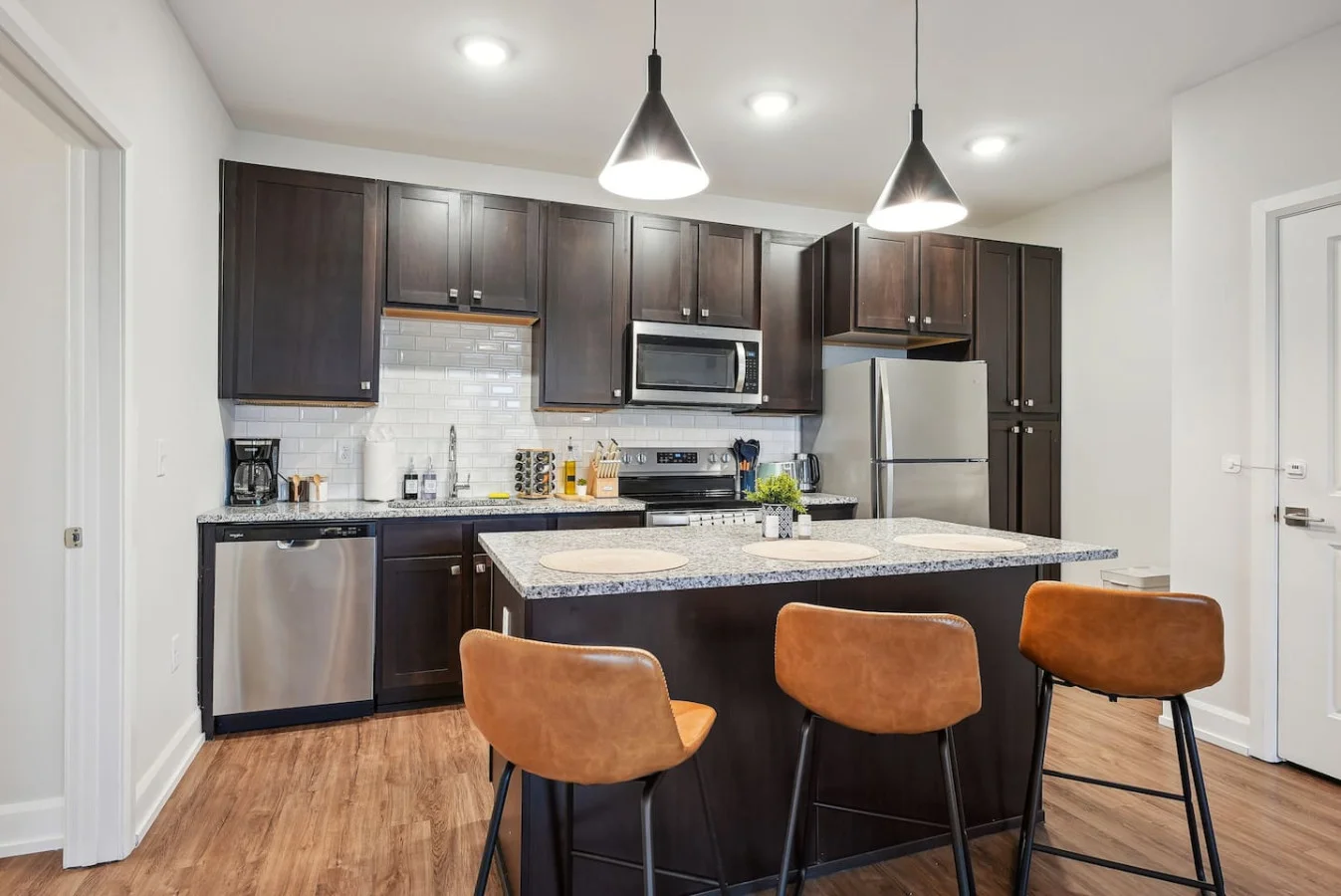 The kitchen’s open layout allows you to move freely as you prepare meals, with everything you need at your fingertips.