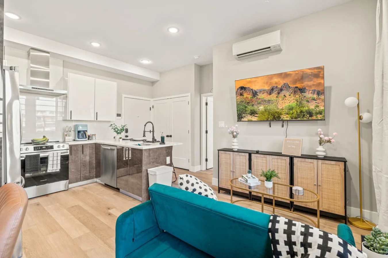 You feel a sense of peace as you step into the living room , with its inviting decor and soothing tones.