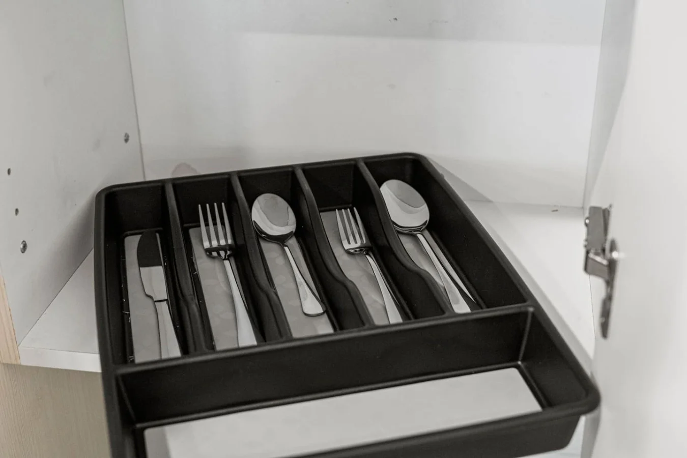 Kitchen cabinets stocked with cooking wares, glassware and silverwares, ideal for mixing up your favorite meals and drinks during your stay.