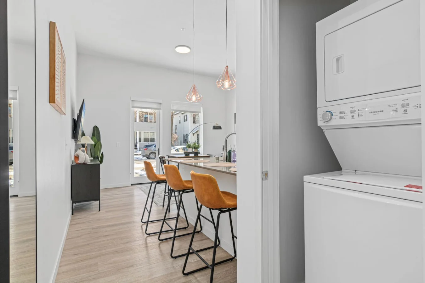 An open-concept area featuring a modern furnishings, and a stylish entertainment setup—ideal for gatherings and relaxation.