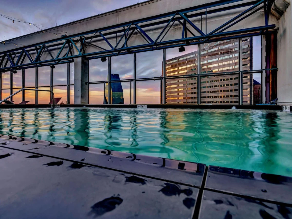 You can imagine yourself lounging by the pool, surrounded by greenery and the gentle sound of water.
