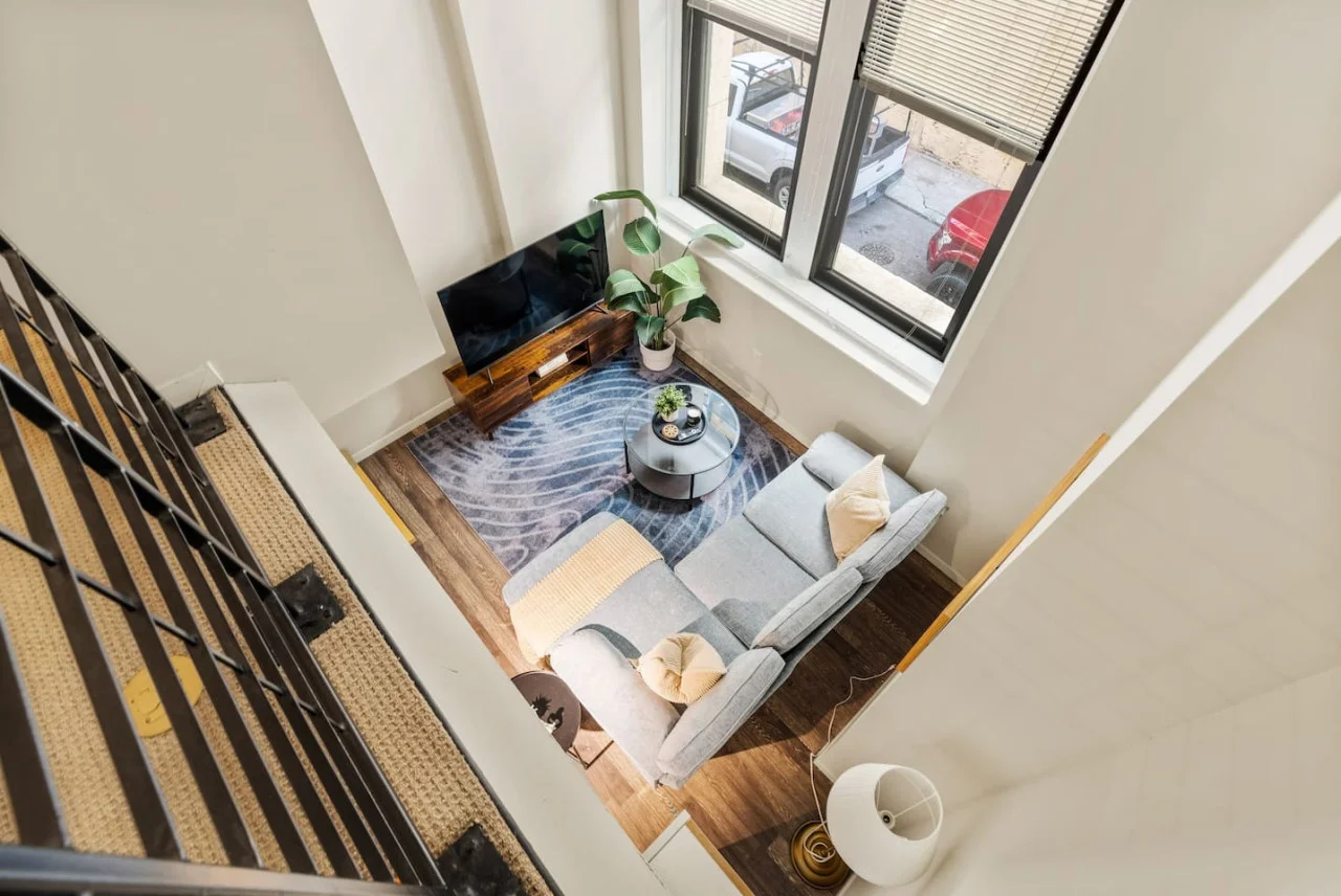 The living room is filled with natural light, creating a bright and welcoming space that invites relaxation.