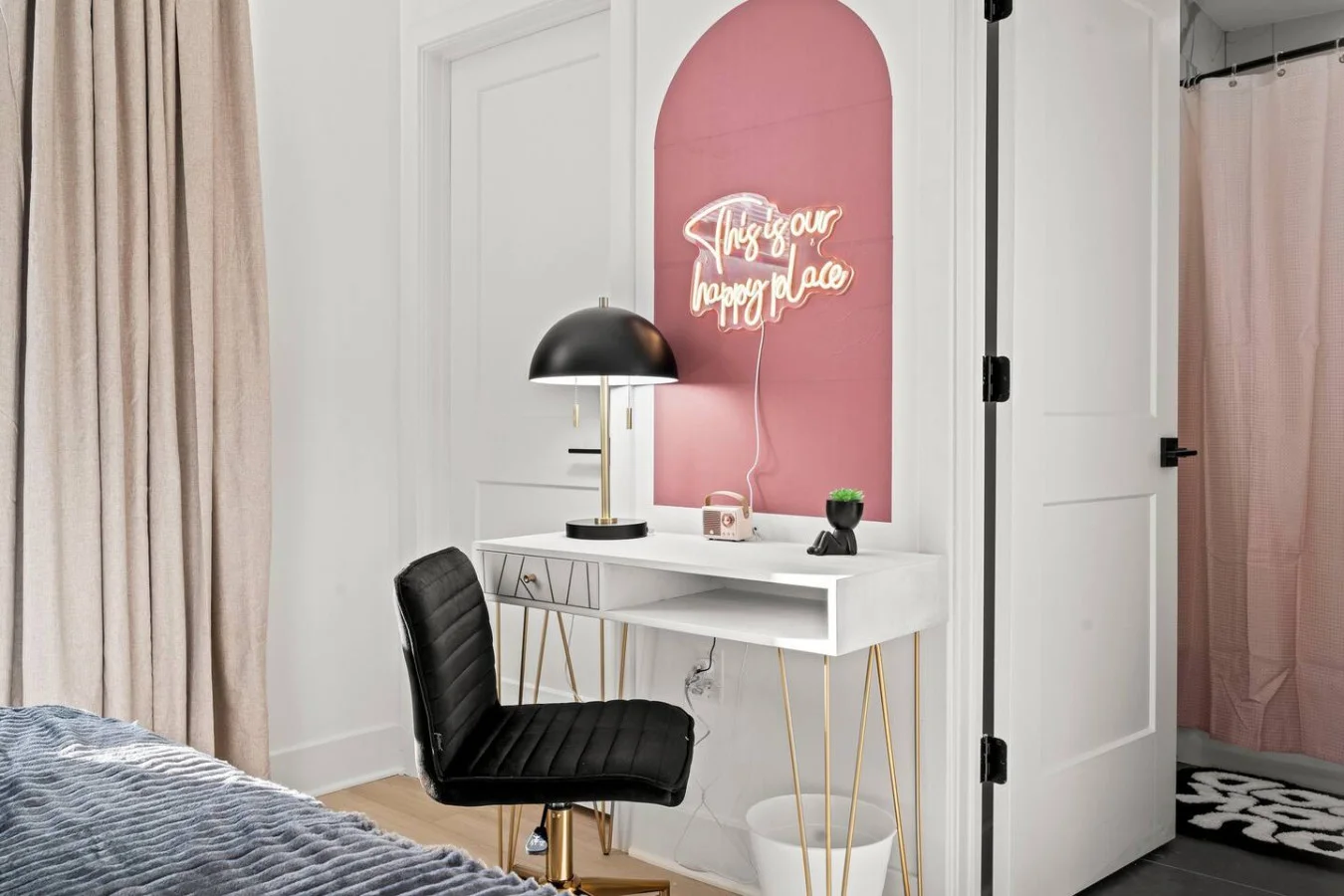 Dedicated workspace with a table, chair, and lamp.