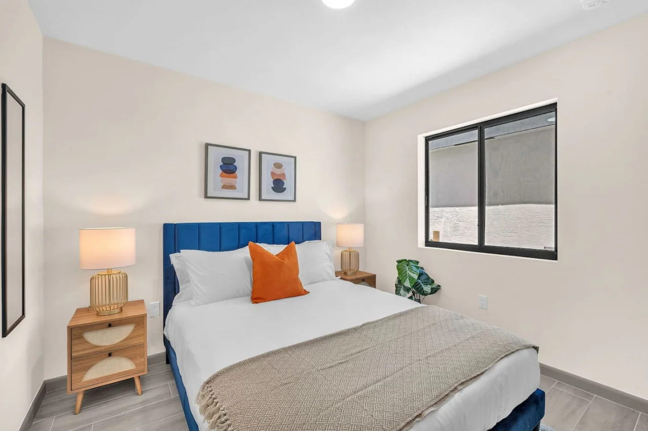 Luxurious bedroom featuring a comfortable bed, elegant decor, and plenty of natural light for a rejuvenating sleep.