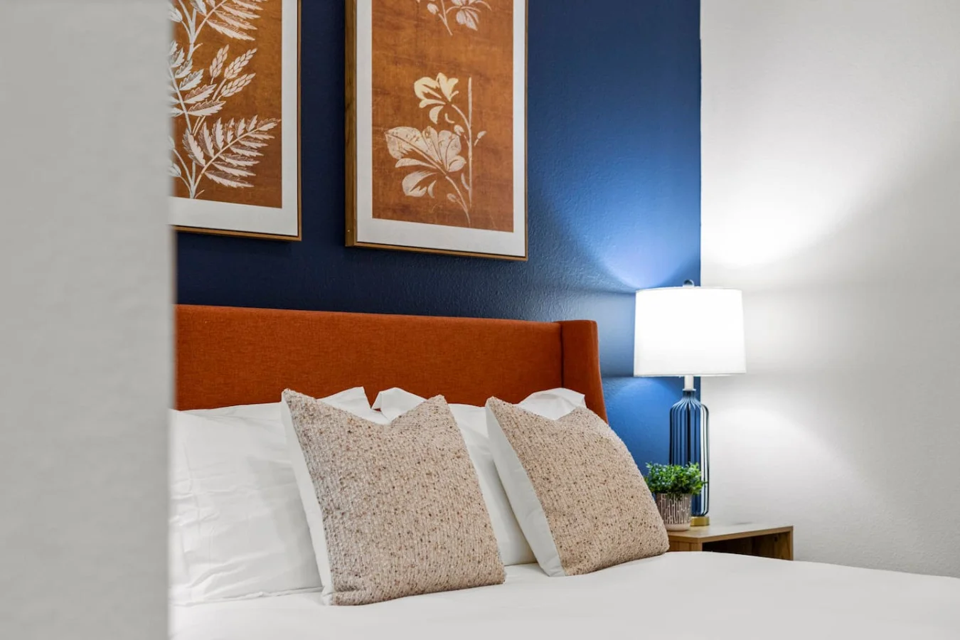 You feel enveloped in comfort as you relax on the queen bed, surrounded by a room designed for tranquility.
