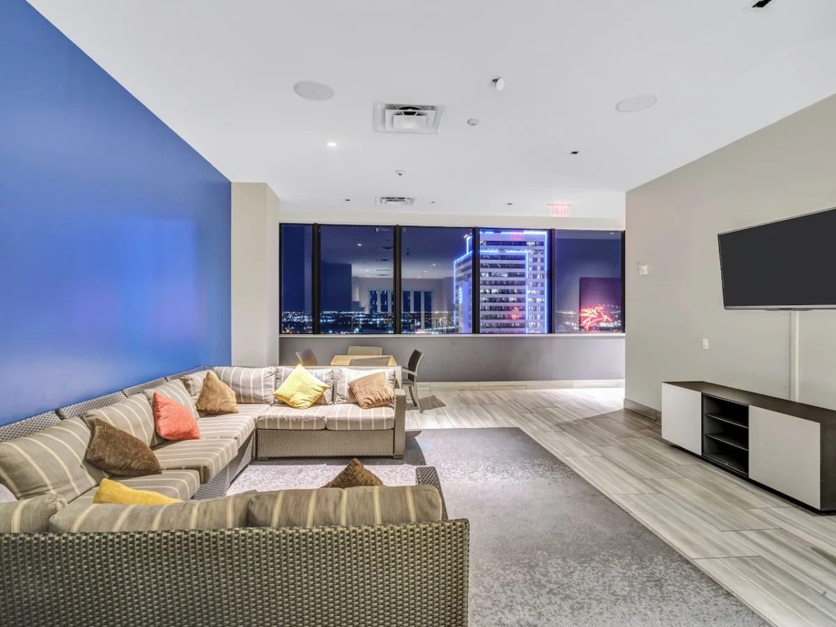 The living room is filled with natural light, creating a bright and welcoming space that invites relaxation.