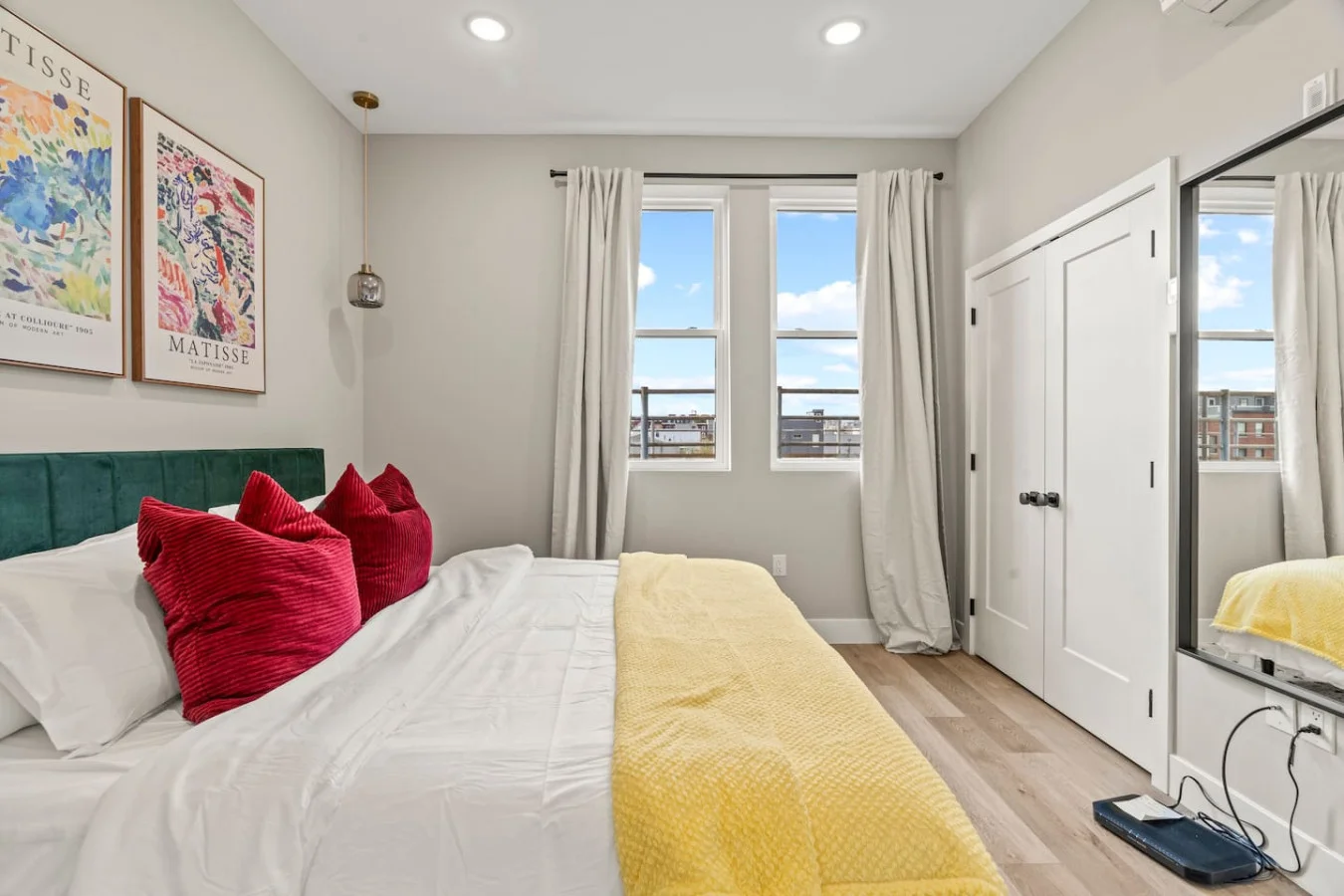 You feel enveloped in comfort as you relax on the queen bed, surrounded by a room designed for tranquility.