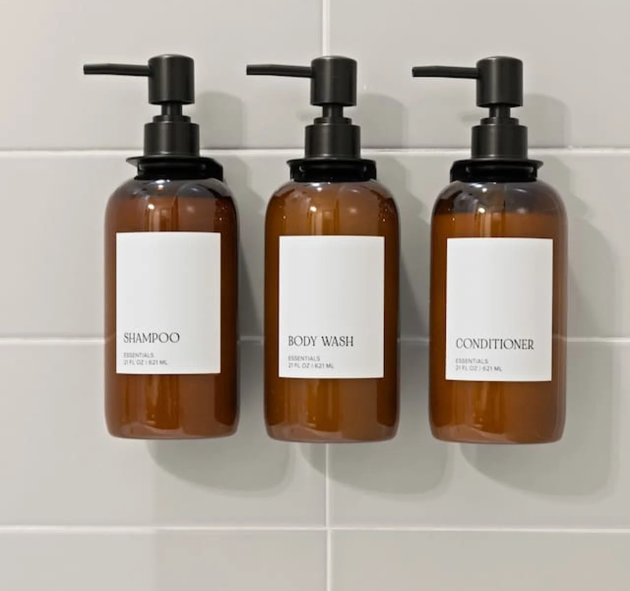 Immaculate bathroom featuring a spacious shower, fresh towels, and complimentary toiletries for a spa-like experience.