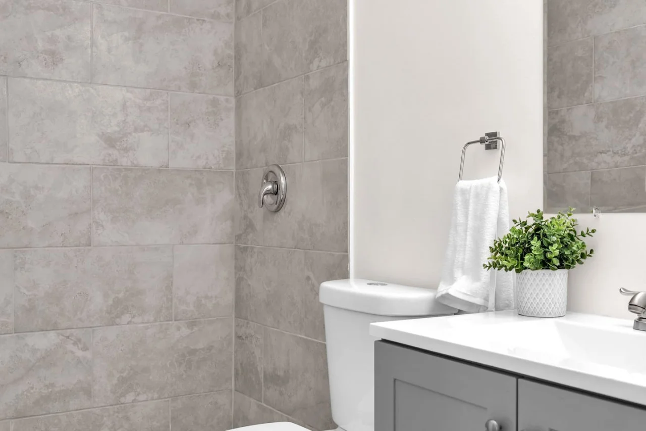 Elegant washroom design with grey-toned tiles