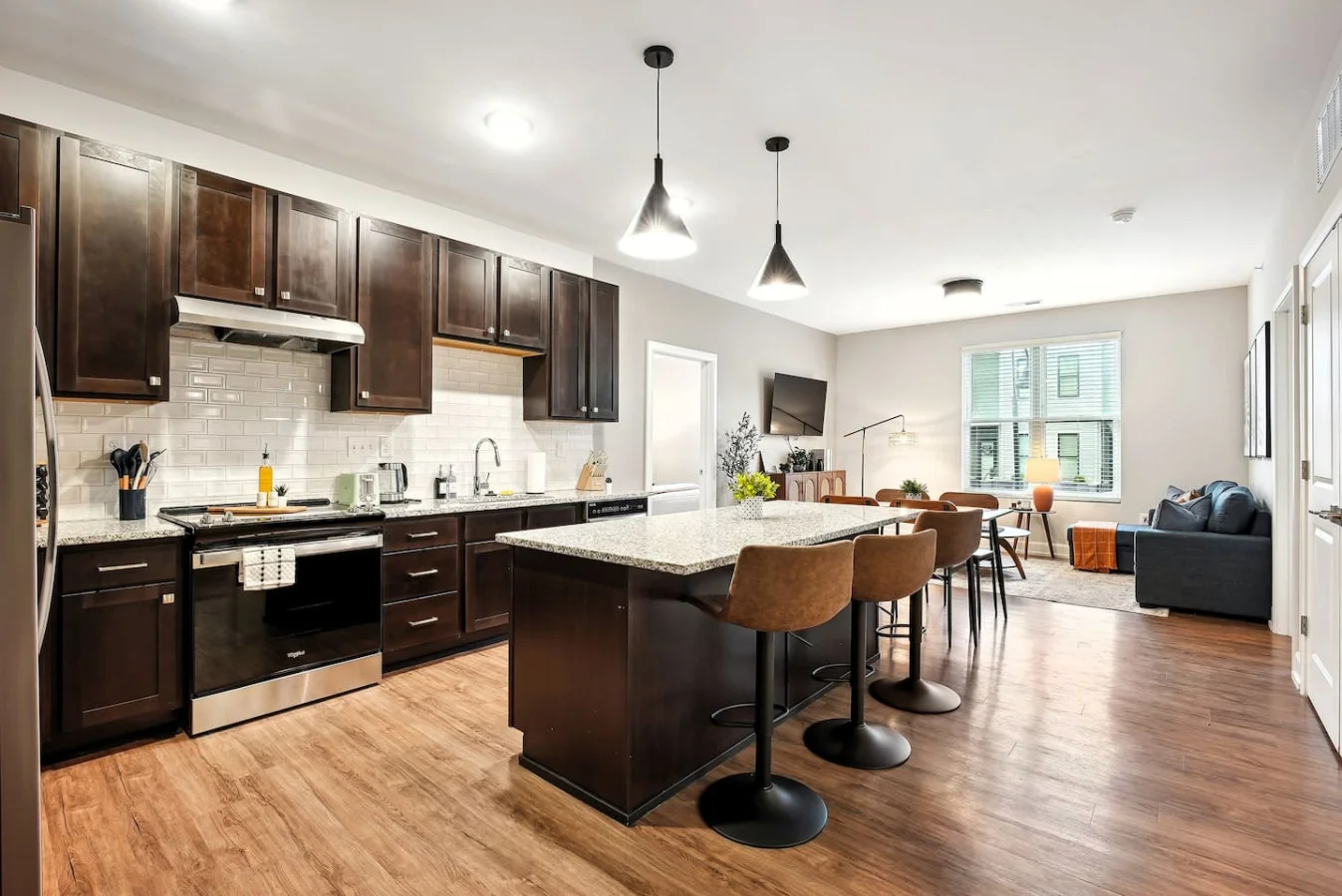 An open-concept area featuring a modern furnishings, and a stylish entertainment setup—ideal for gatherings and relaxation.