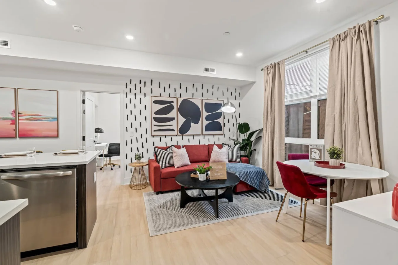 Living Room with Pull Out Sofa Bed, Coffee Table, Dining Table, 55" TV, Overhanging Reading Light