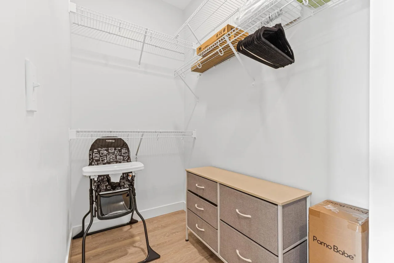 Modern built-in closets with hangers and shelving, perfect for keeping your clothes organized during your stay.