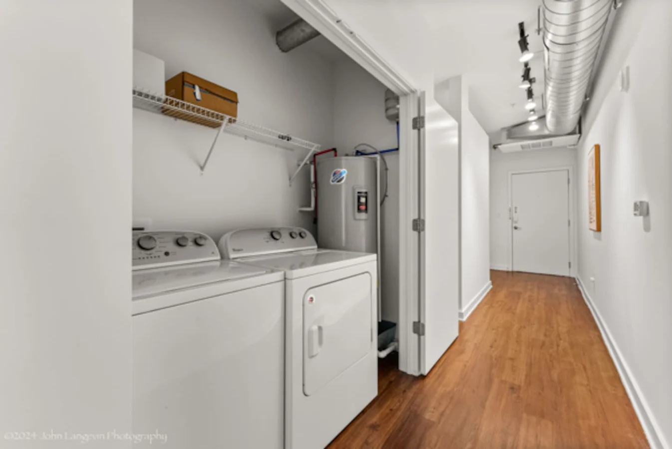 Convenient laundry room with washer, dryer, and all necessary supplies, making it easy to take care of your laundry needs.