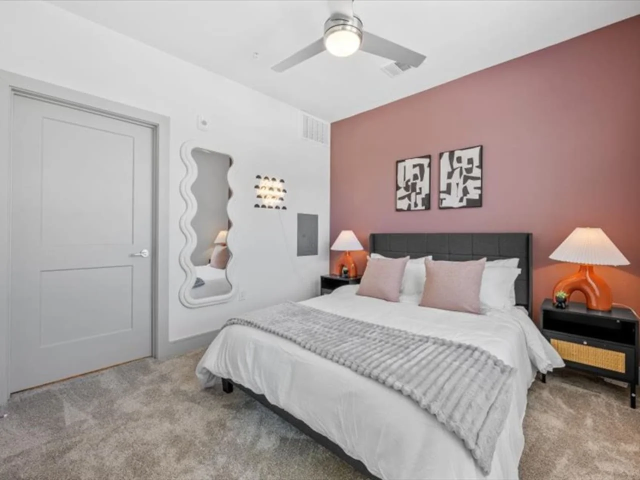 The bedroom offers a luxurious retreat, with a bed that promises restful nights and a room that feels like a private oasis.