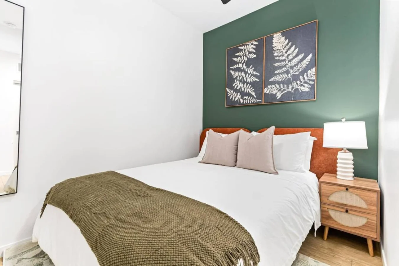 The bedroom offers a luxurious retreat, with a bed that promises restful nights and a room that feels like a private oasis.