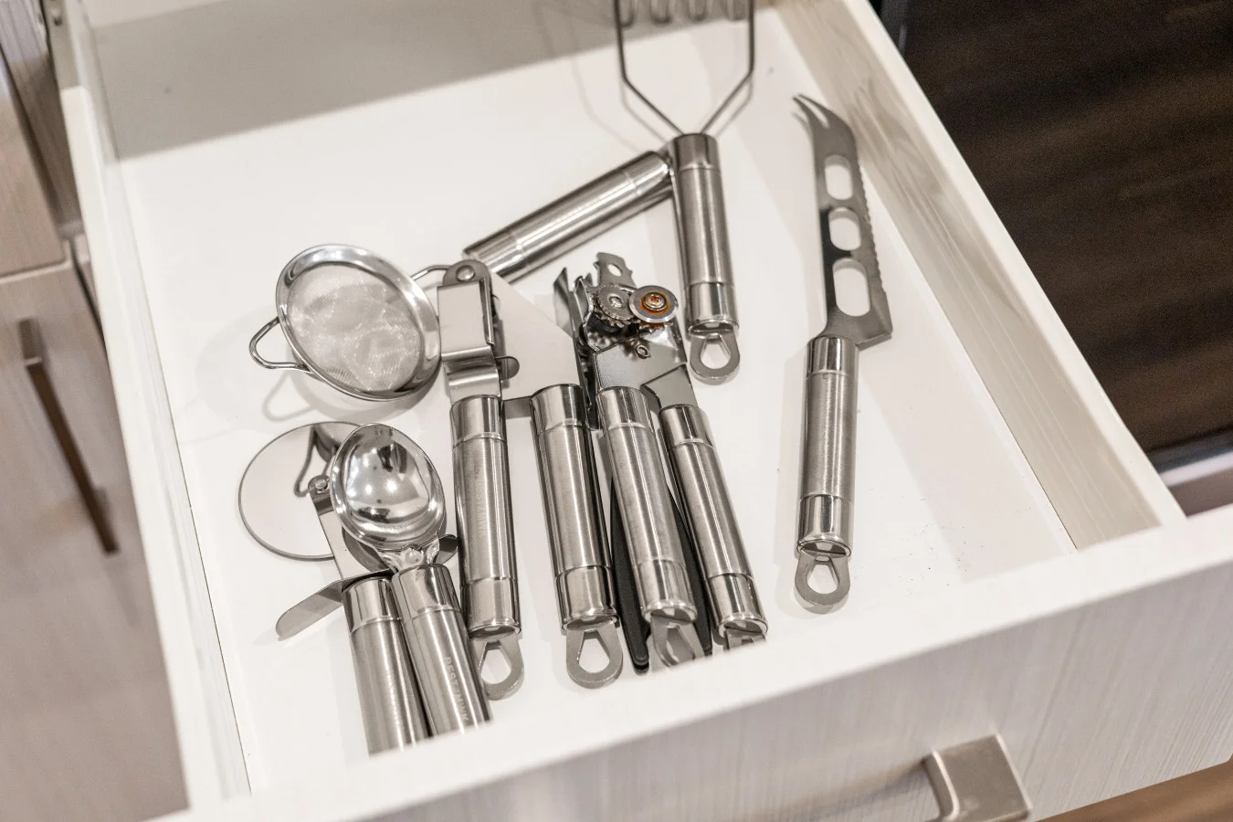 Fully equipped kitchen drawer with essential utensils, ready for all your cooking needs.