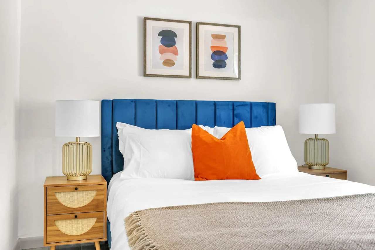 Abstract art above the bed.