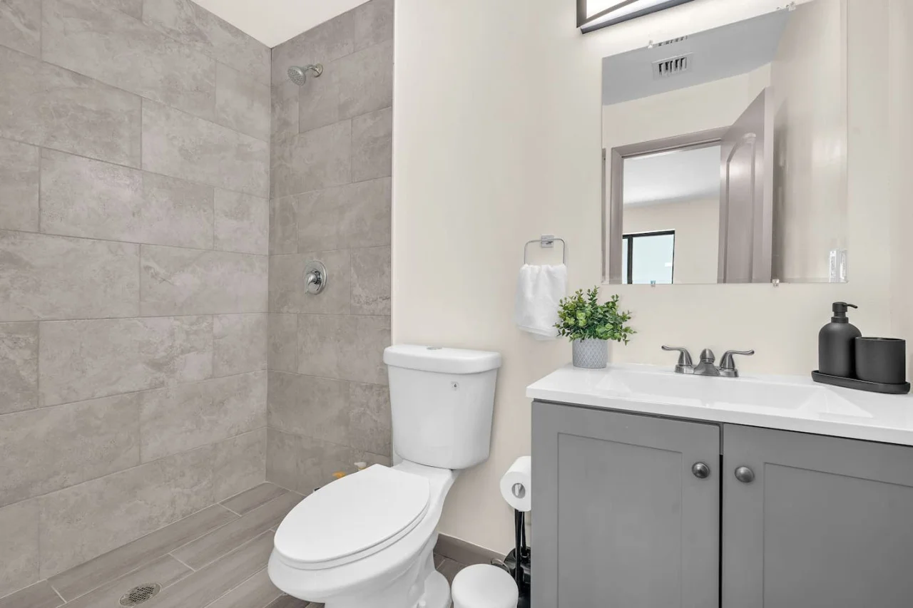 You feel a sense of calm as you enter the bathroom, where the thoughtful design and high-quality materials create a serene environment.