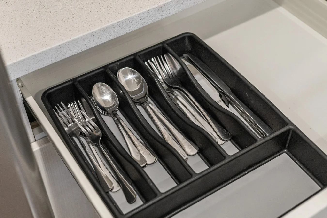 Thoughtfully organized kitchen utensils for your convenience.