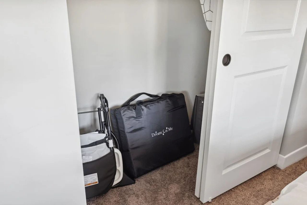 Sleek closet doors hide plenty of storage space, ensuring your room remains open and tidy during your stay.