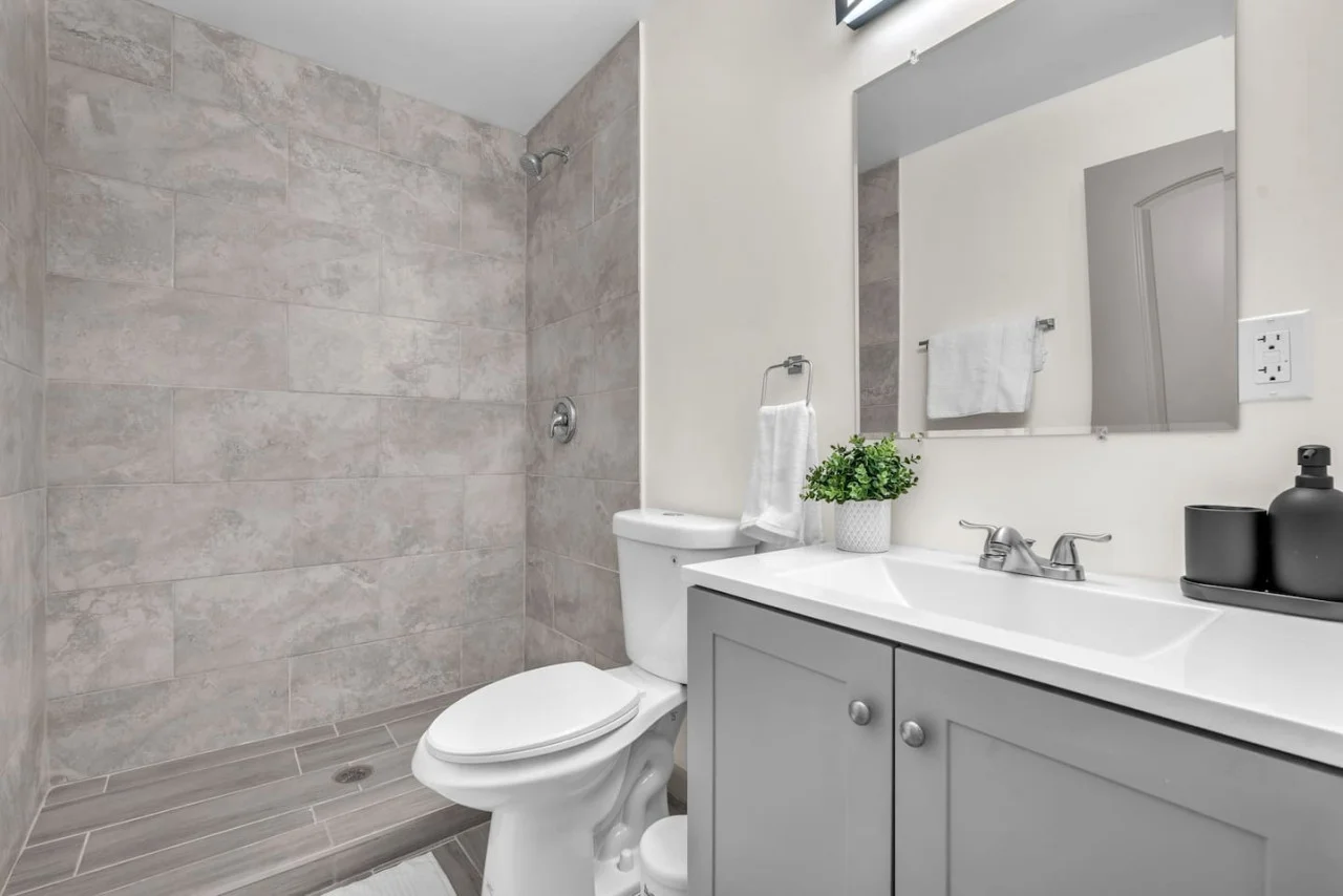 Stylish and functional bathroom with a walk-in shower, clean white walls, and contemporary fixtures for a relaxing experience.