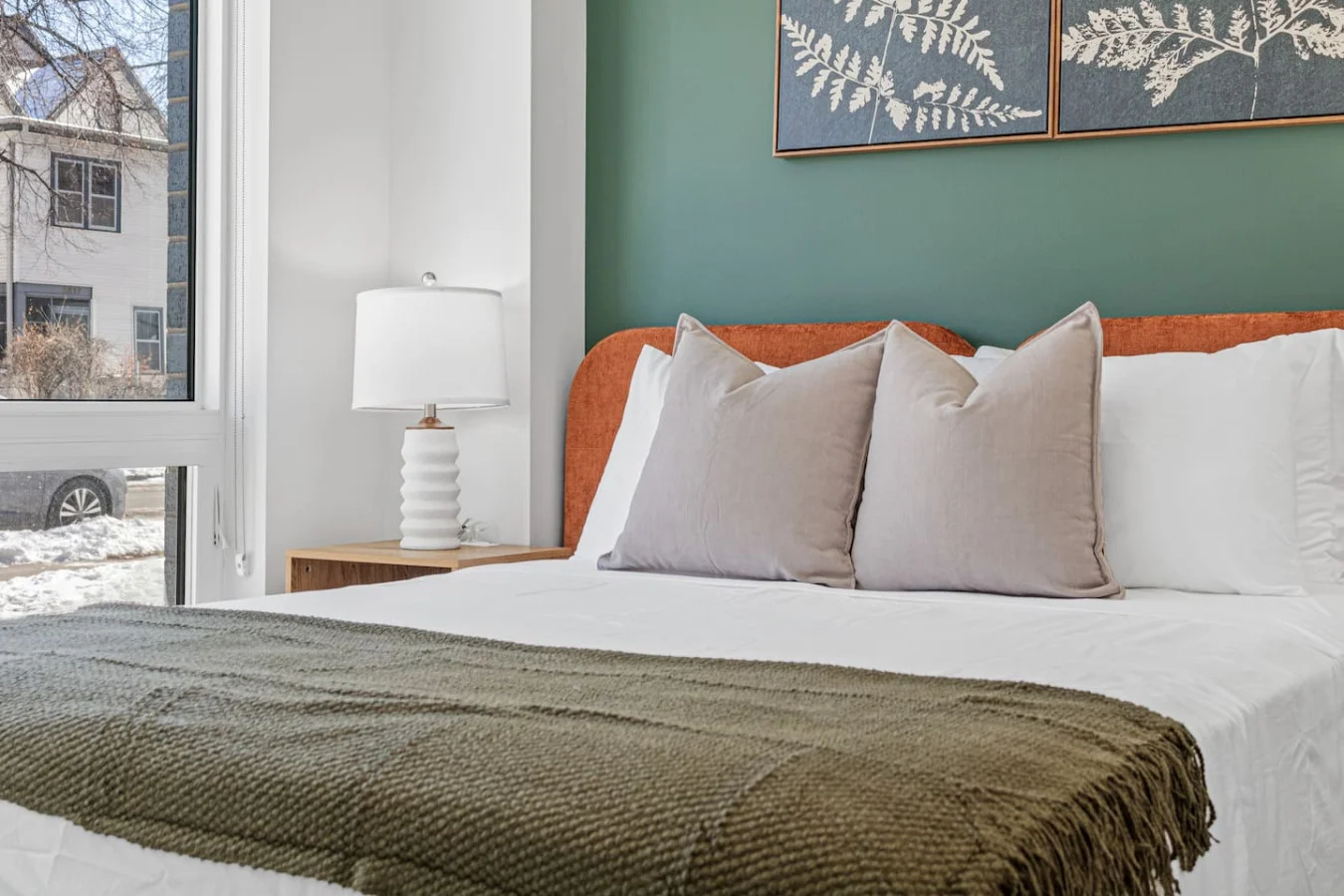 The bedroom’s serene ambiance invites you to relax, with a plush bed that promises a restful night's sleep.