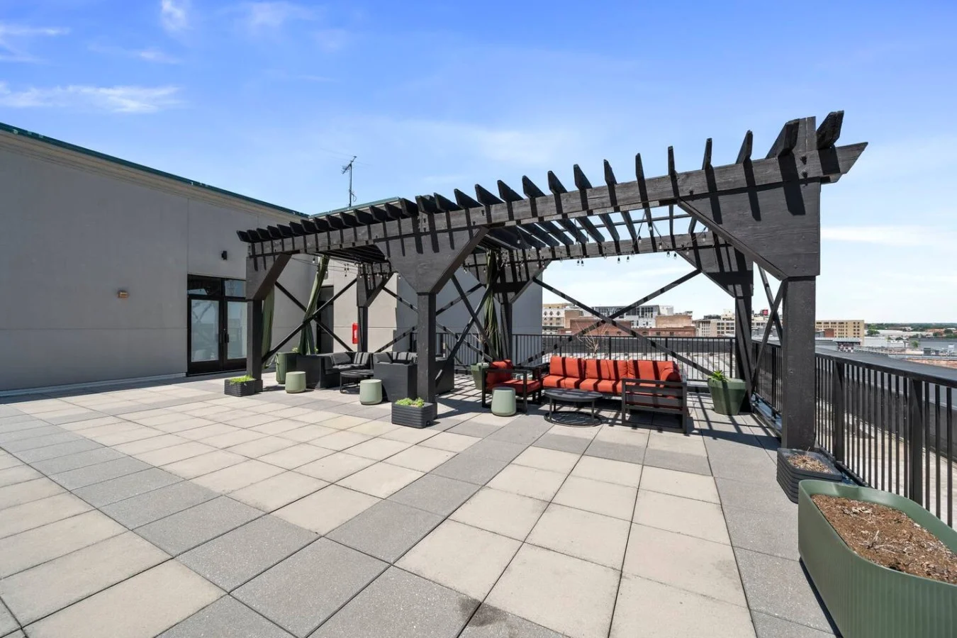Enjoy city views and evenings under the stars in the expansive rooftop seating area and social pergola