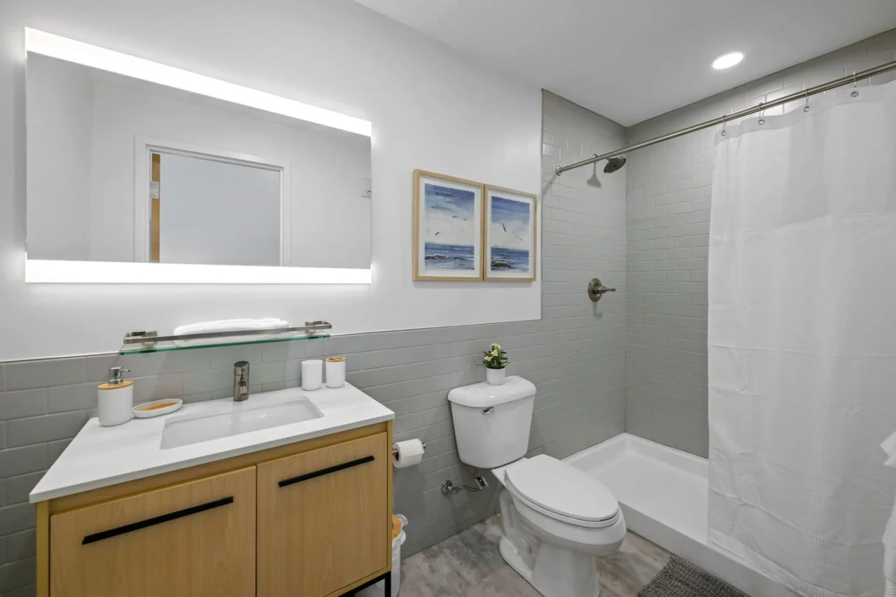 As you step into the bathroom, the clean lines and soothing colors create a space where you can relax and refresh.