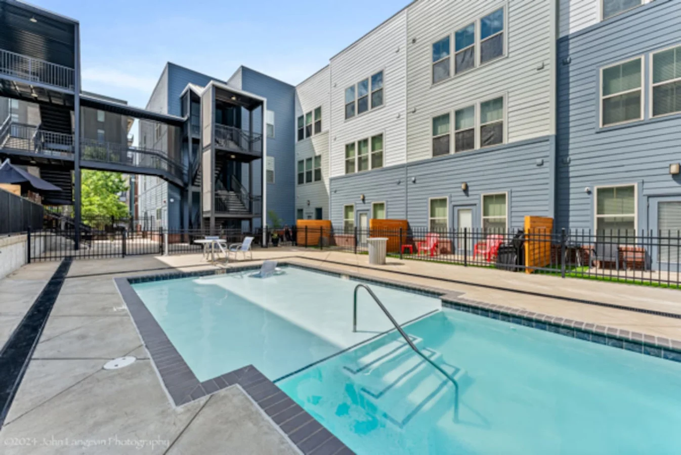 Sparkling private pool with lounge chairs and plenty of space to soak up the sun, ideal for lazy afternoons and refreshing dips.
