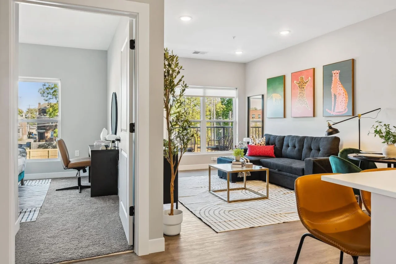 You feel a sense of peace as you step into the living room , with its inviting decor and soothing tones.