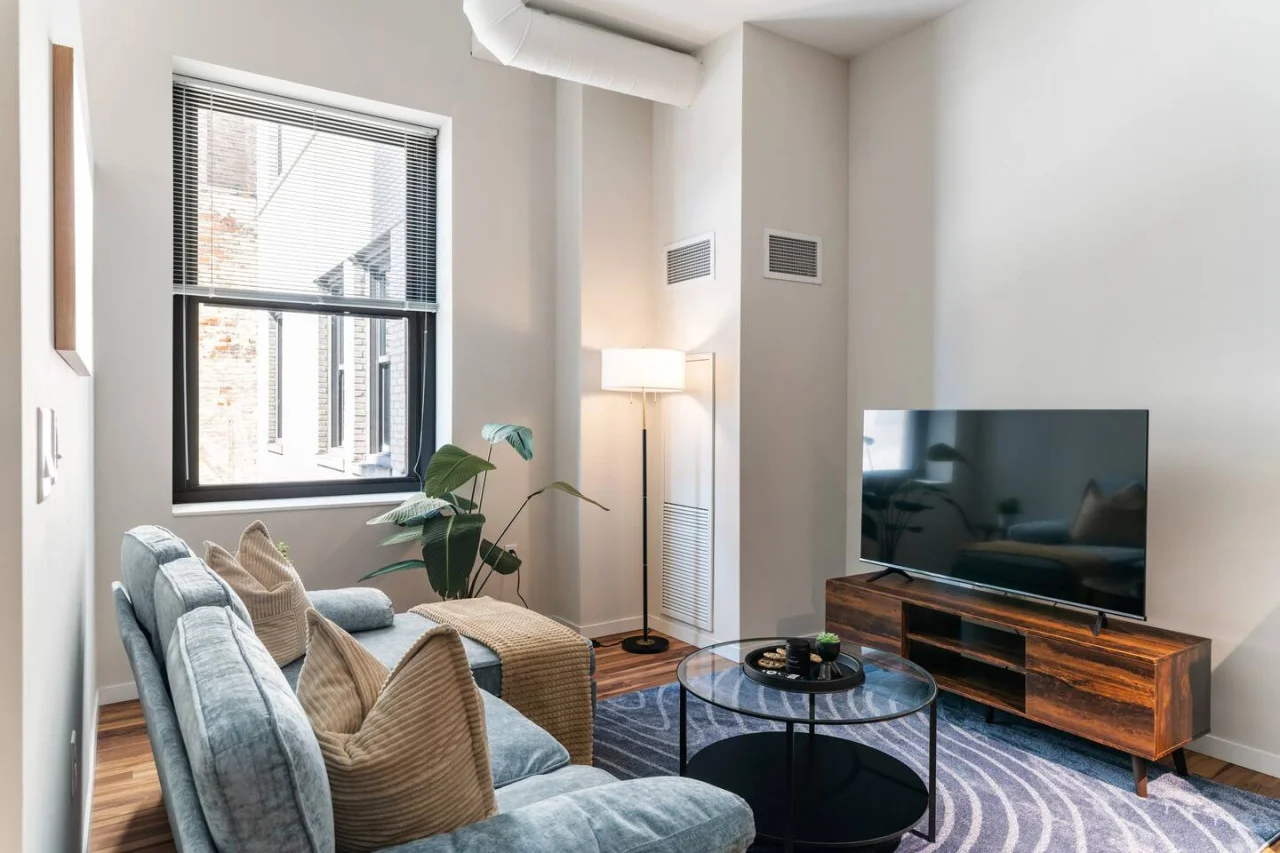 You feel a sense of peace as you step into the living room , with its inviting decor and soothing tones.