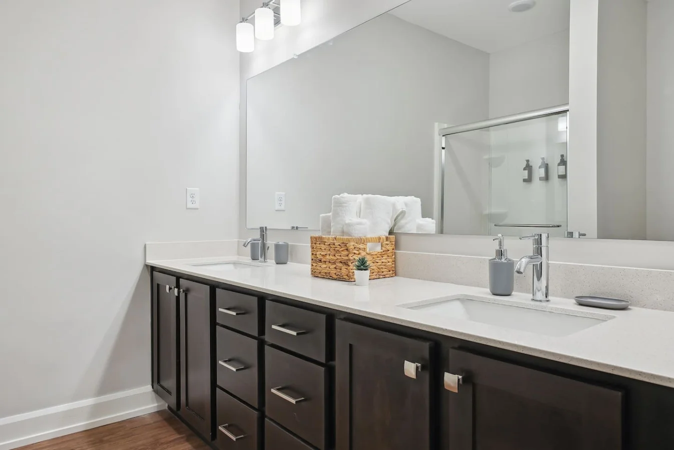 The bathroom is designed for comfort, with a spacious shower and elegant fixtures that make every moment feel luxurious.