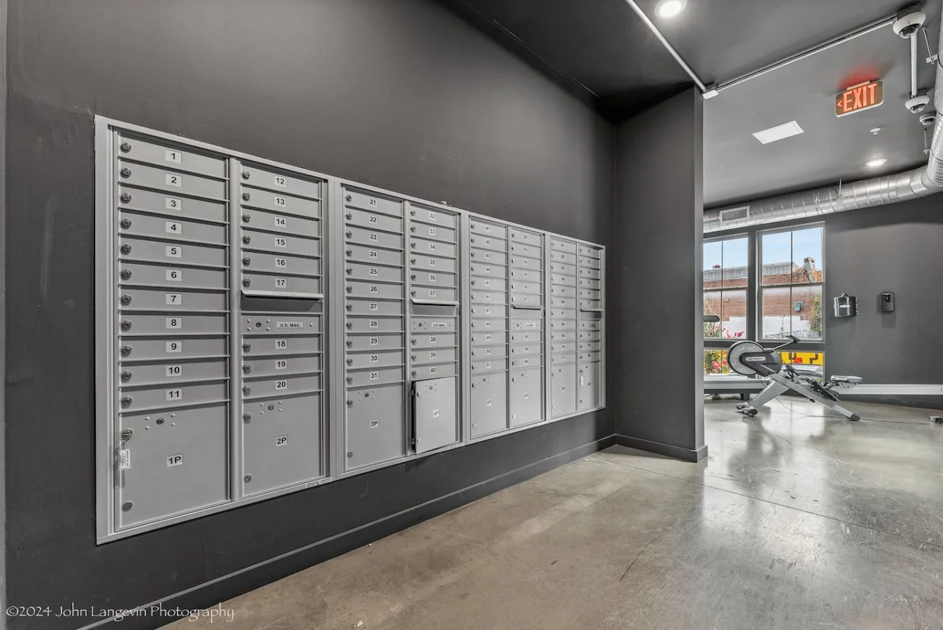 Open floor area with exercise mats, yoga balls, and foam rollers for warm-ups, stretching, or core exercises.