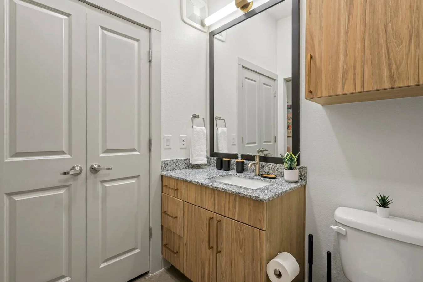 You feel a sense of calm as you enter the bathroom, where the thoughtful design and high-quality materials create a serene environment.