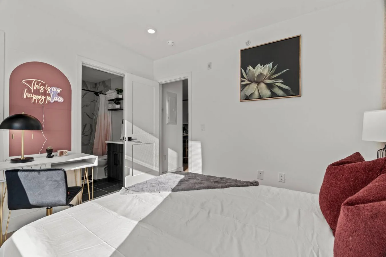 You feel enveloped in comfort as you relax on the queen bed, surrounded by a room designed for tranquility.
