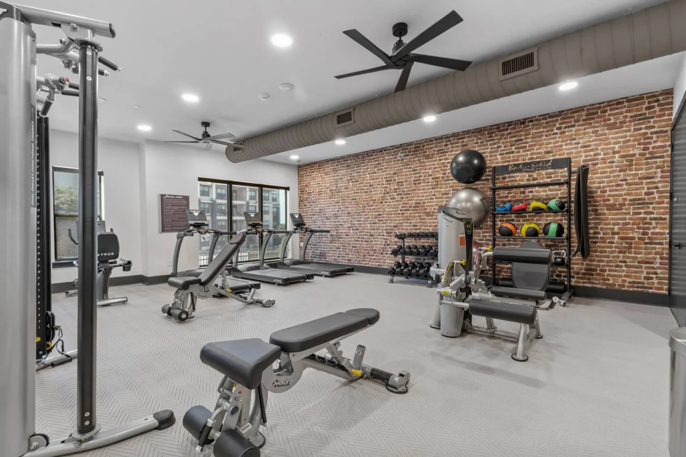 Versatile workout area featuring mats, yoga balls, and foam rollers to energize your warm-ups and strengthen your core.