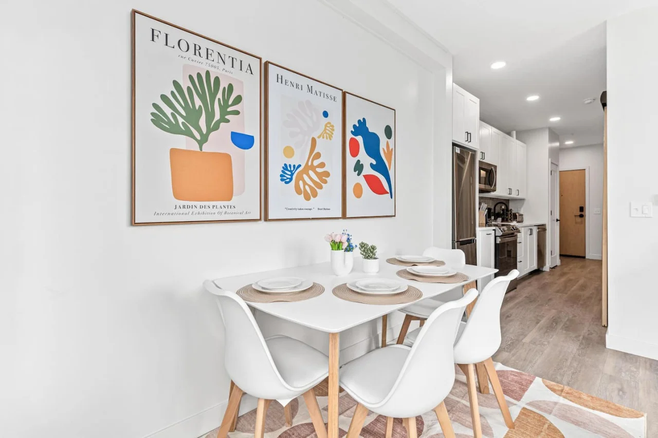 Dining table w/ 4 Place settings - 4 Chairs - Wall Art - Area rug - Easy access to Kitchen