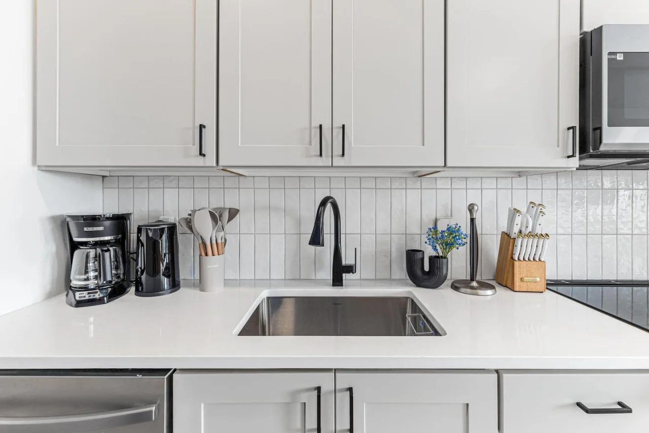 As you open the kitchen, you discover an assortment of coffee pods, and sugar, ensuring you have everything you need for a perfect morning or afternoon pick-me-up.