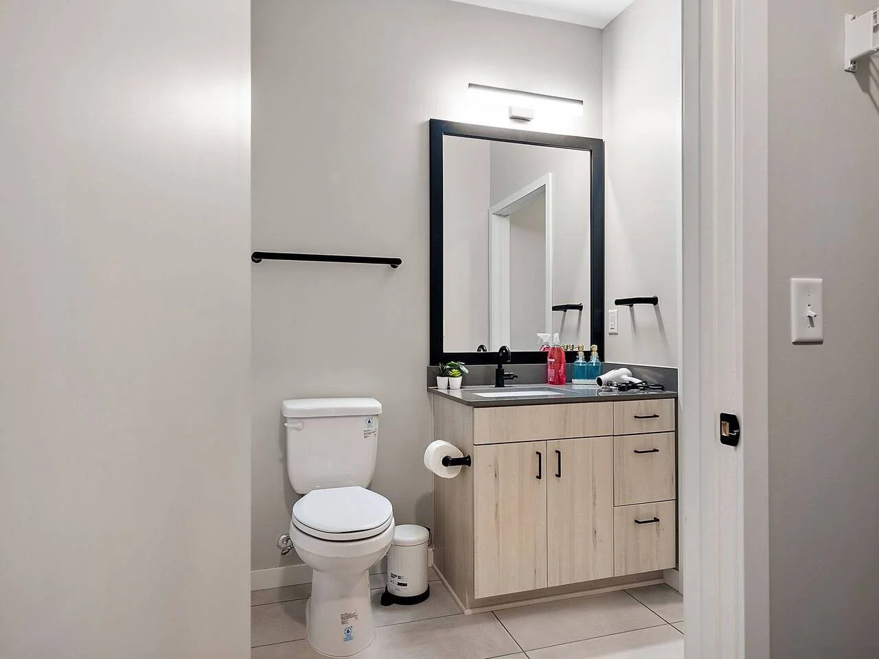 You feel a sense of calm as you enter the bathroom, where the thoughtful design and high-quality materials create a serene environment.