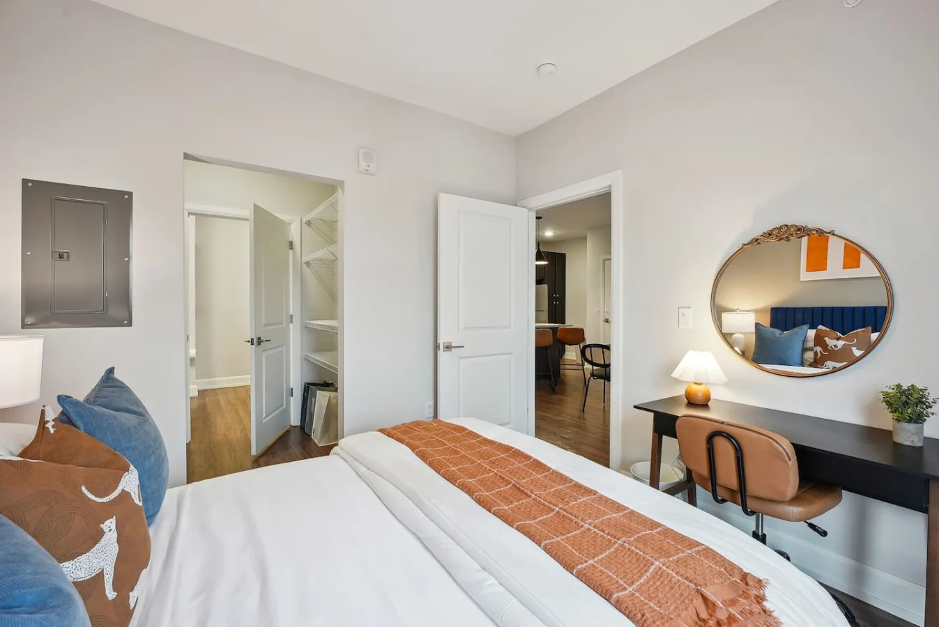 The bedroom offers a luxurious retreat, with a bed that promises restful nights and a room that feels like a private oasis.