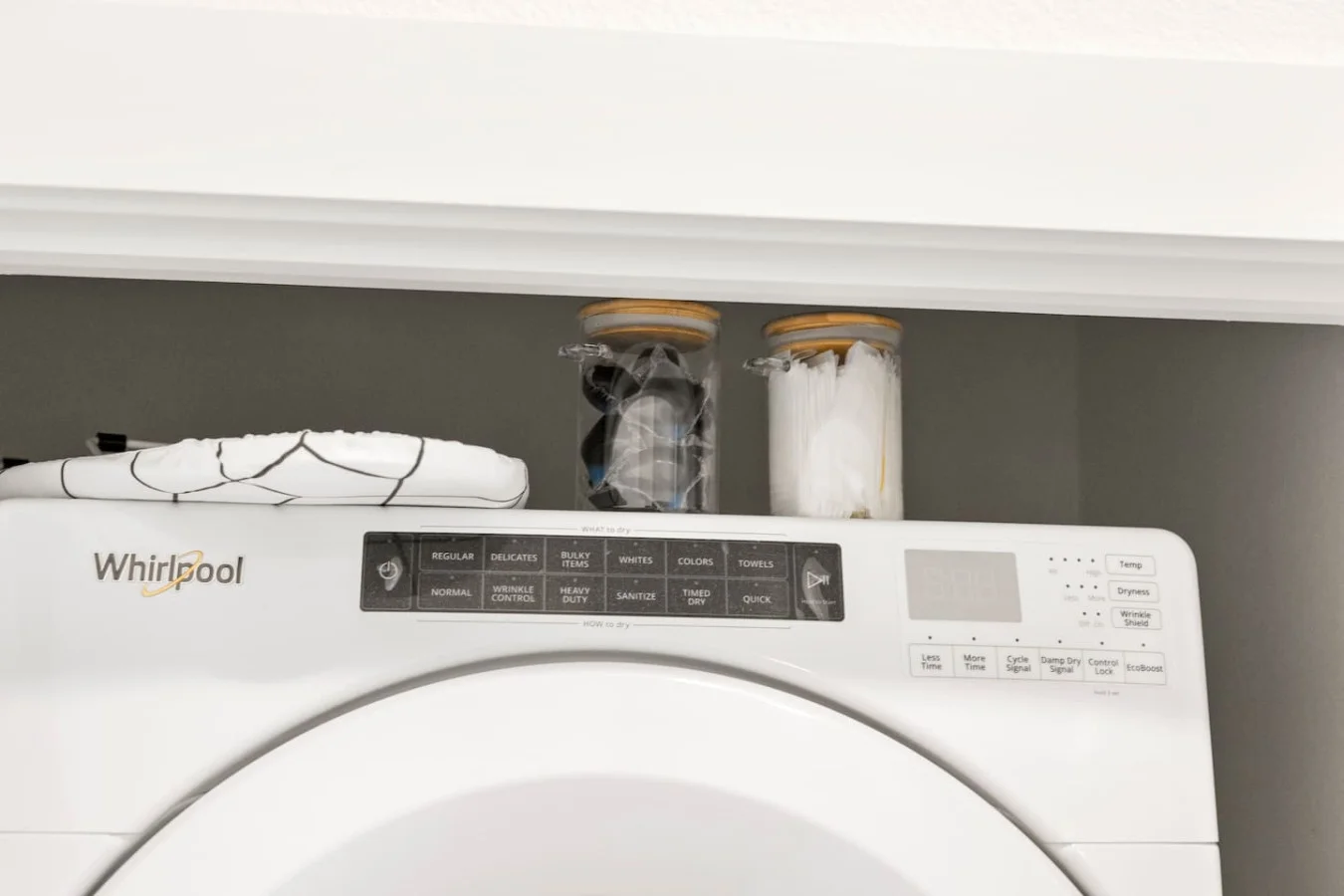 Laundry room with a washer, dryer, and folding area, offering all the convenience you need for a comfortable extended stay.