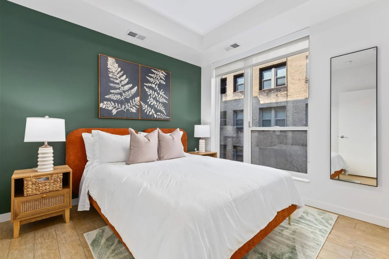The bedroom’s serene ambiance invites you to relax, with a plush bed that promises a restful night's sleep.