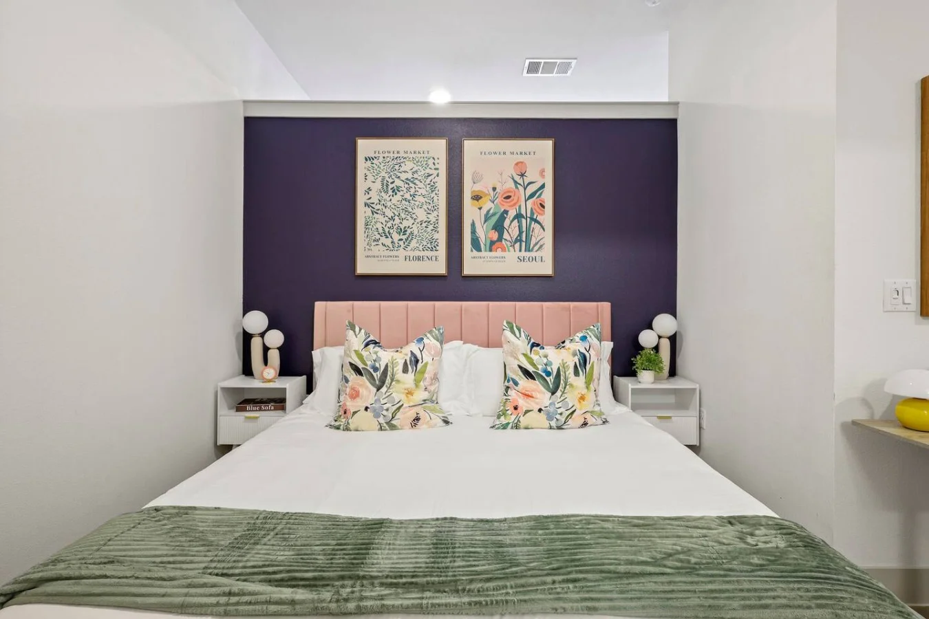 You feel enveloped in comfort as you relax on the queen bed, surrounded by a room designed for tranquility.