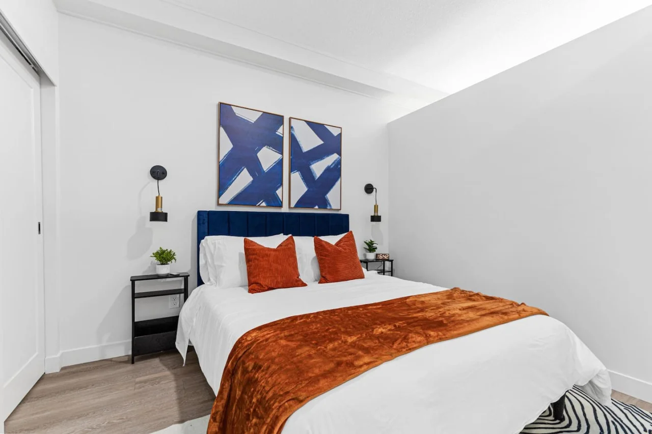 Comfortable Queen size bed - Side tables - Bedside lamps - Wall art - Area rug - Alarm clock, Extra pillows w/ Throw blanket.