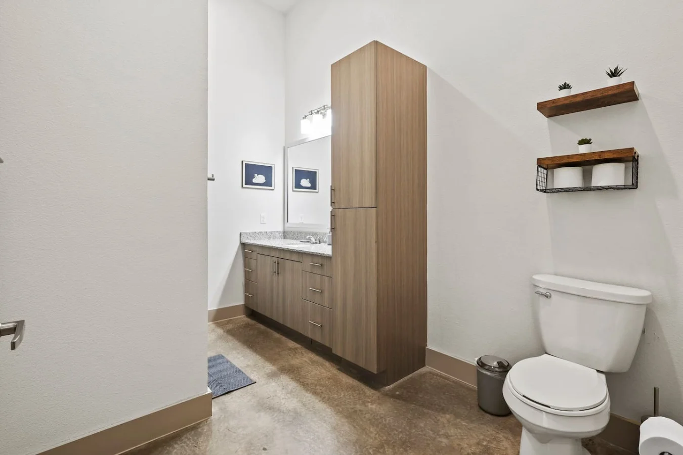 You feel a sense of calm as you enter the bathroom, where the thoughtful design and high-quality materials create a serene environment.